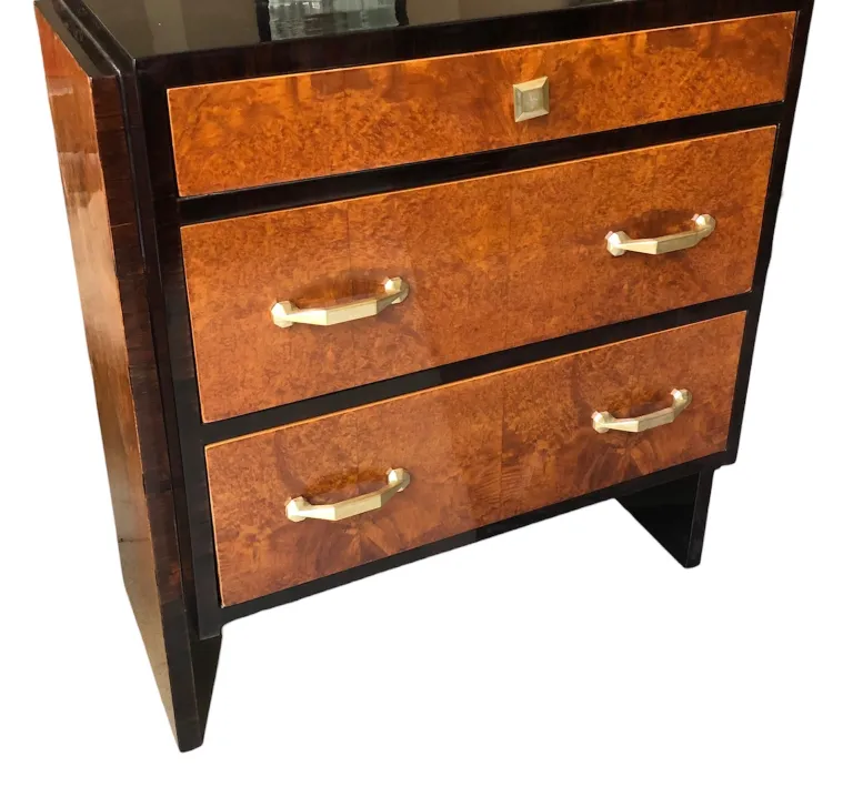 Antique cabinet with rich brown finishes and golden handles.