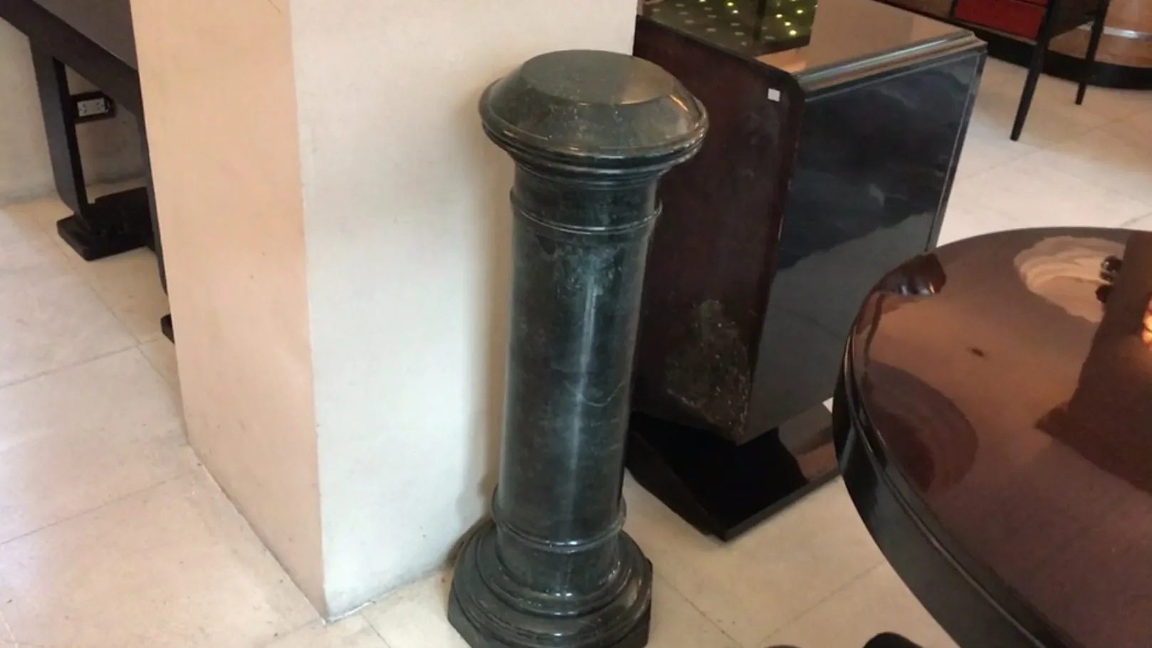 Antique decorative column in an elegant setting.