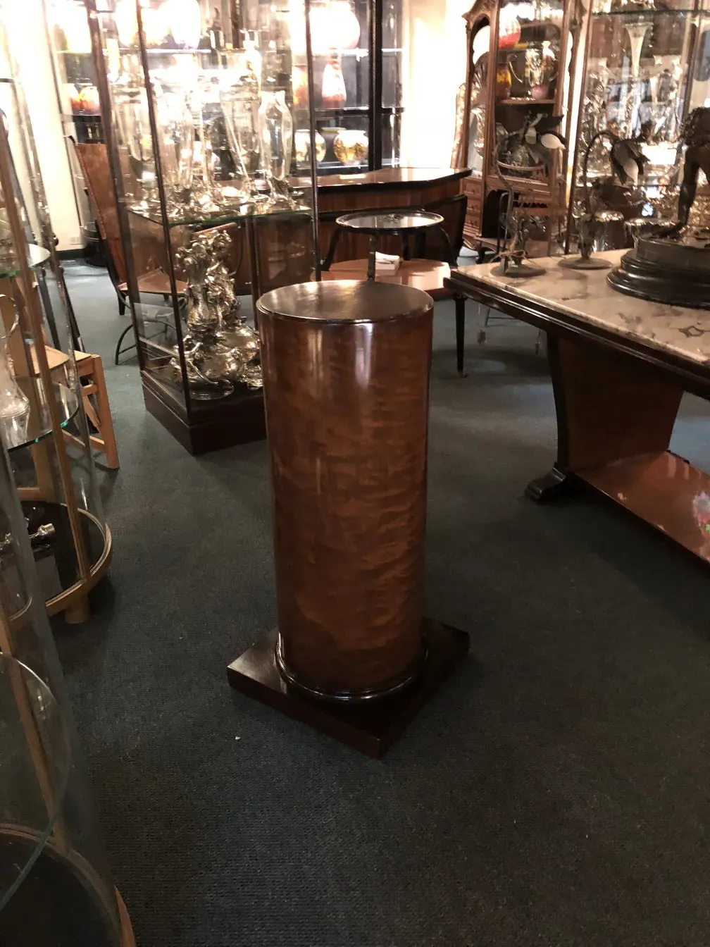 antique column with decorative base in exhibition room