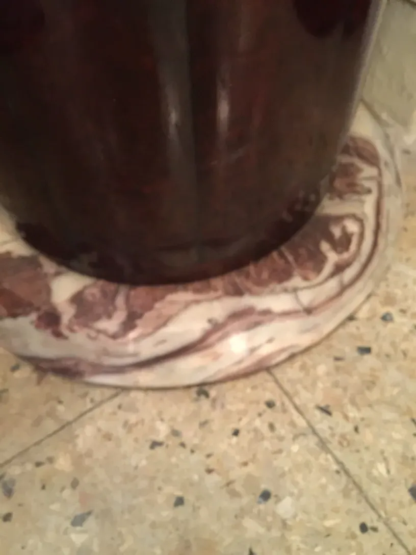 view of an antique decorative column with detailed base