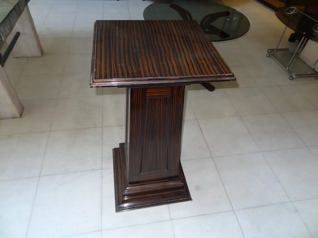 antique column with striped surface and wide base