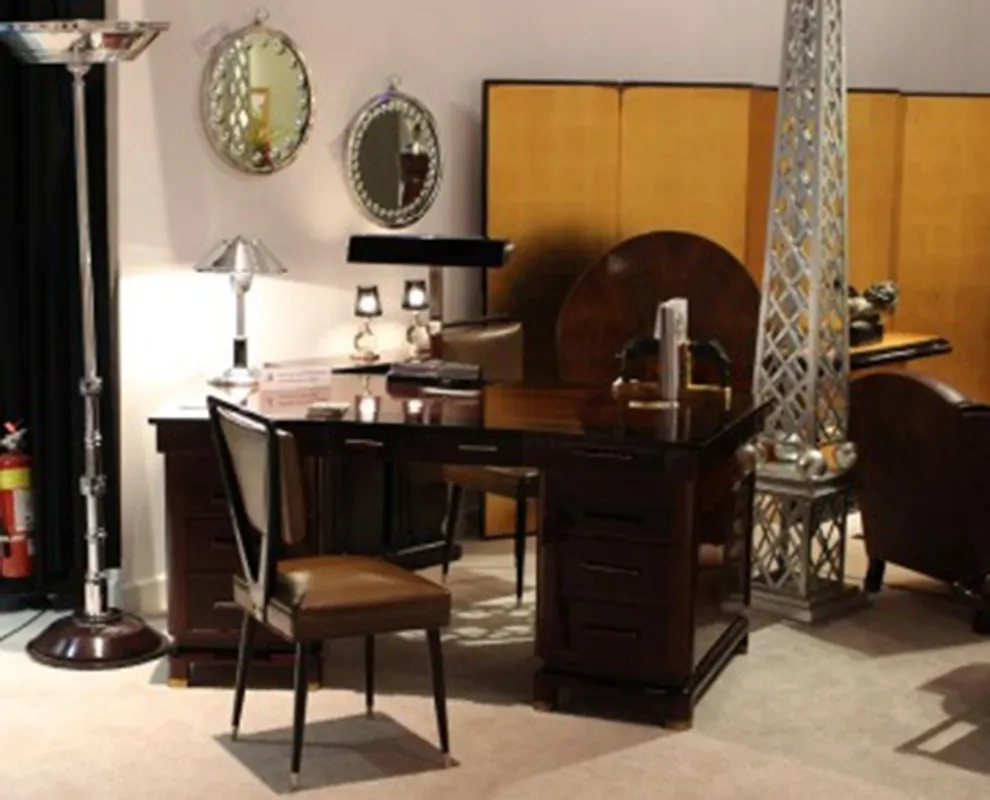antique desk with multiple mirrors and lamps.
