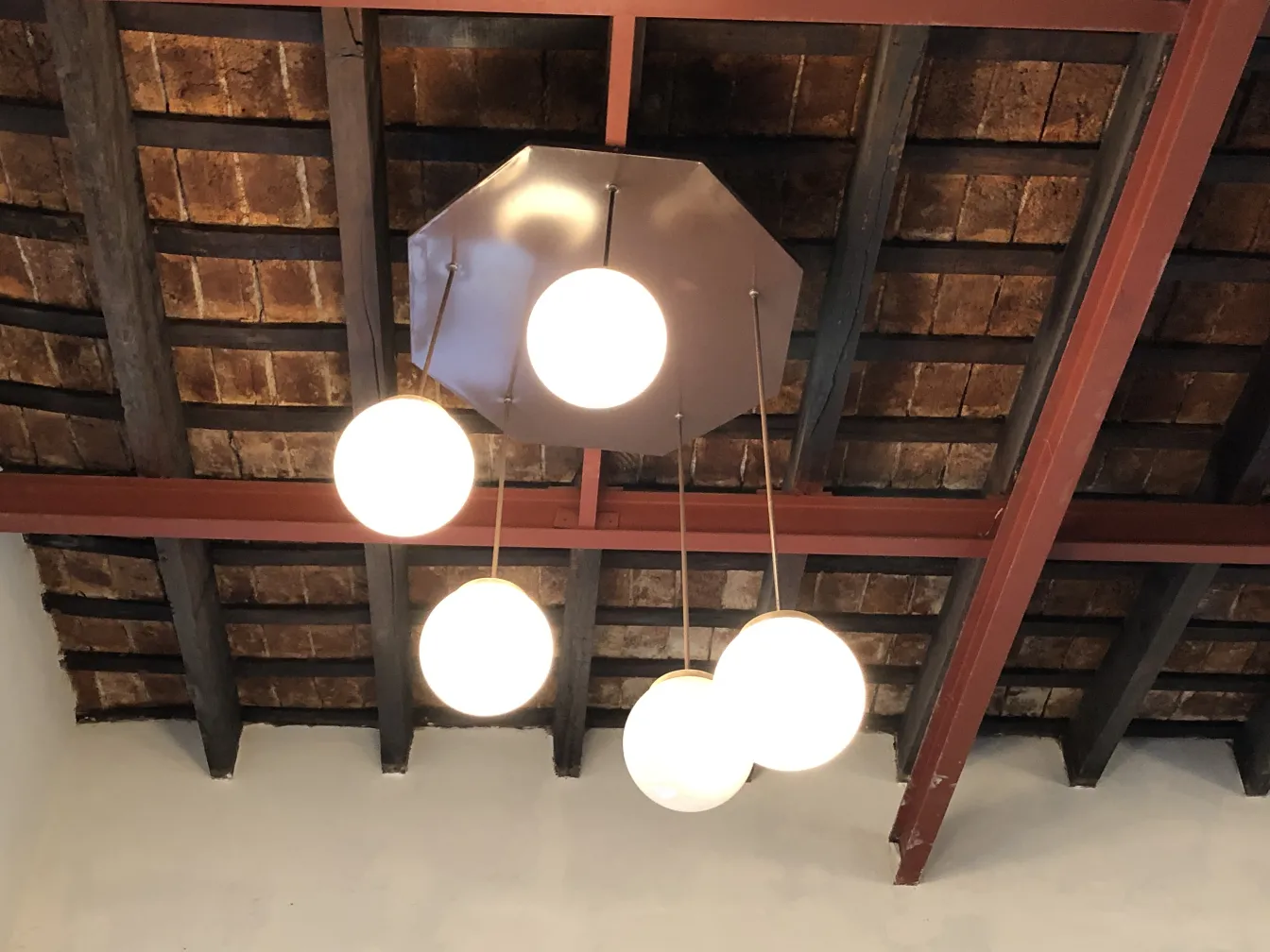 Four antique hanging lamps with spherical designs