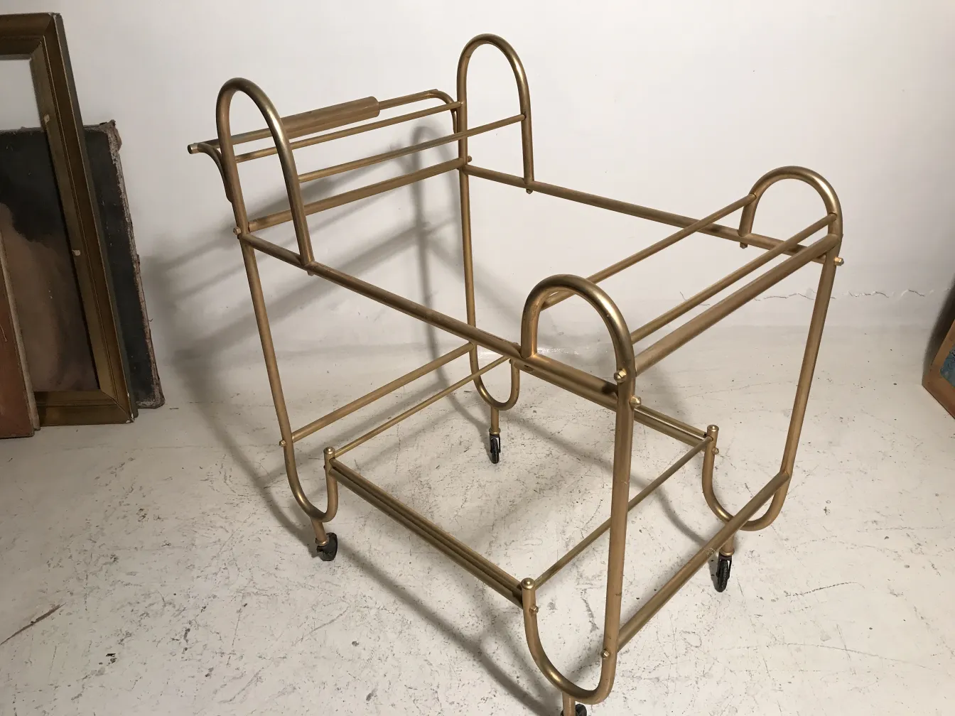 antique cocktail trolley in golden color with wheels