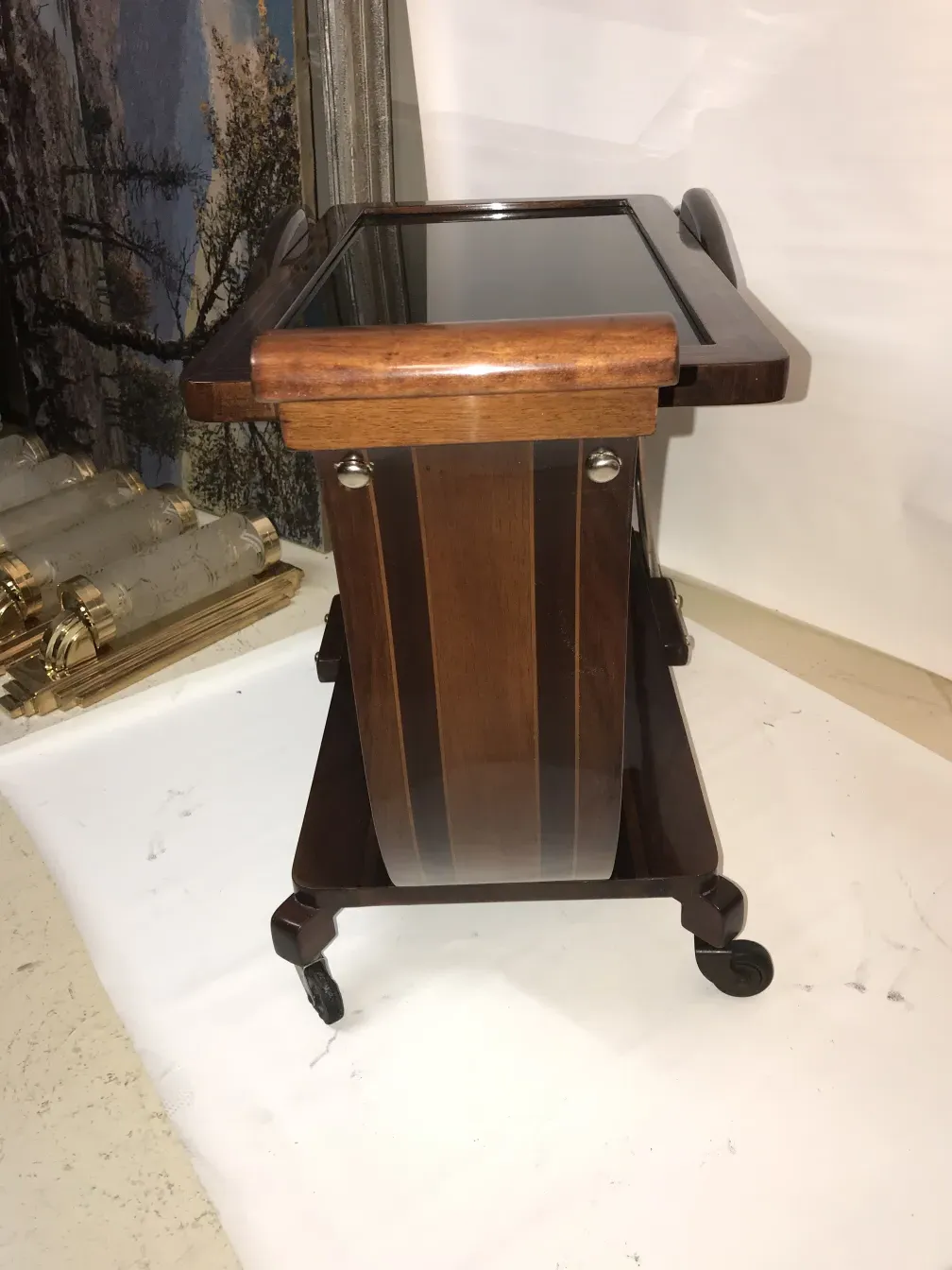 Antique wooden cocktail trolley with wheels.