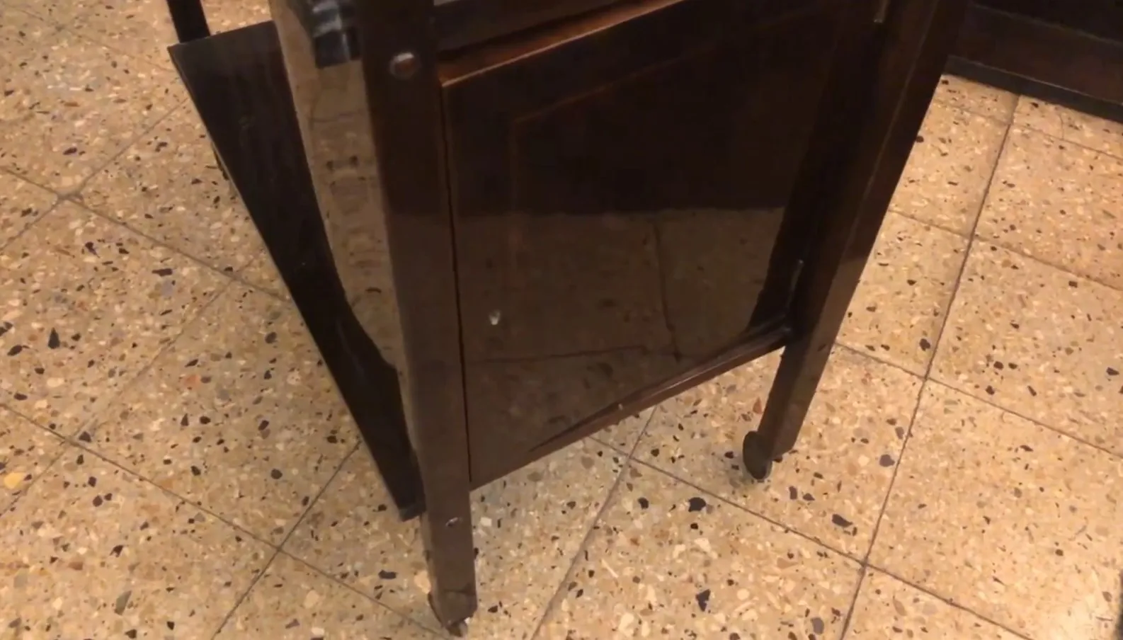 Antique cocktail trolley with elegant design details.