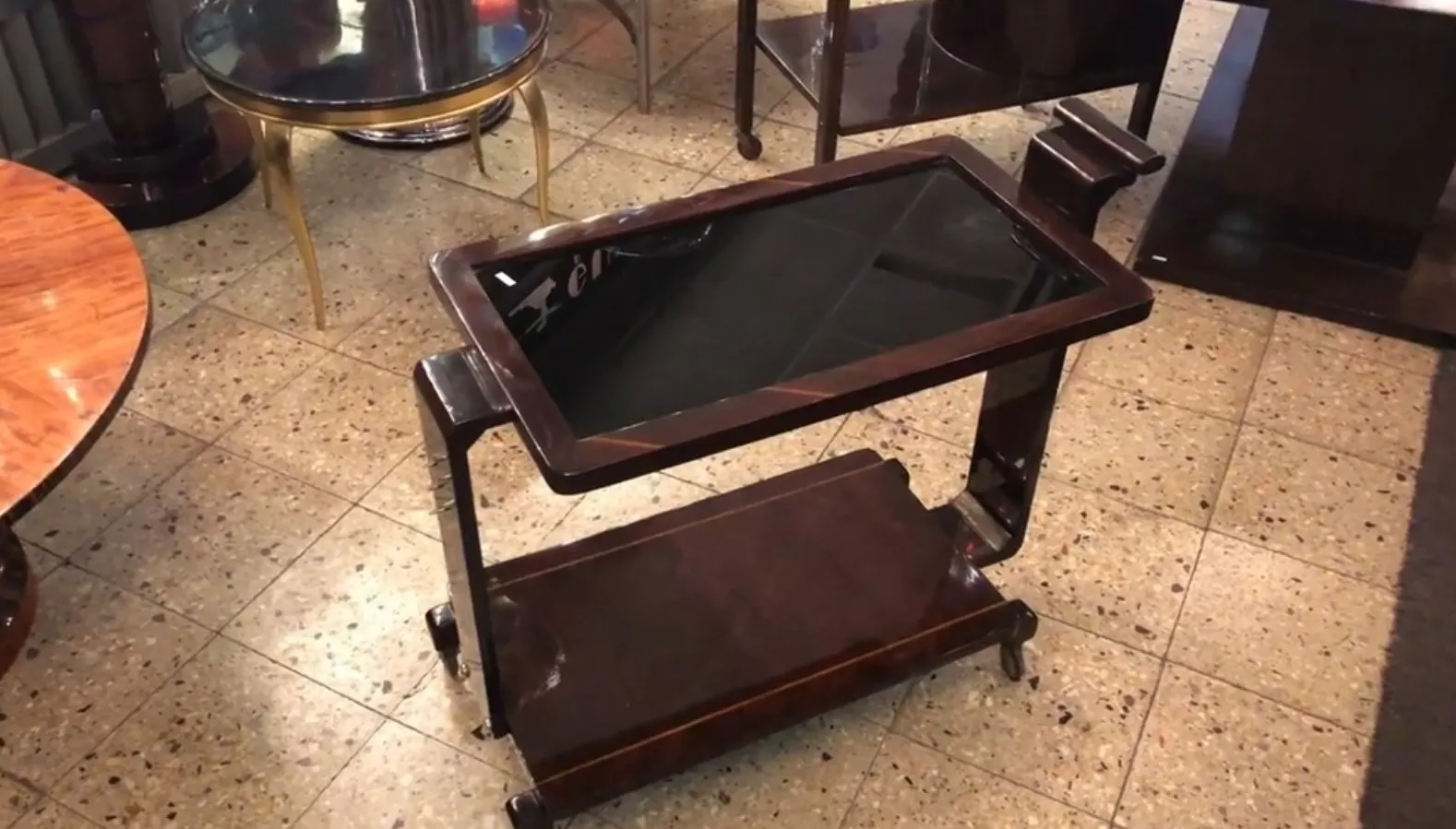 Antique cocktail trolley with two shelves and black top