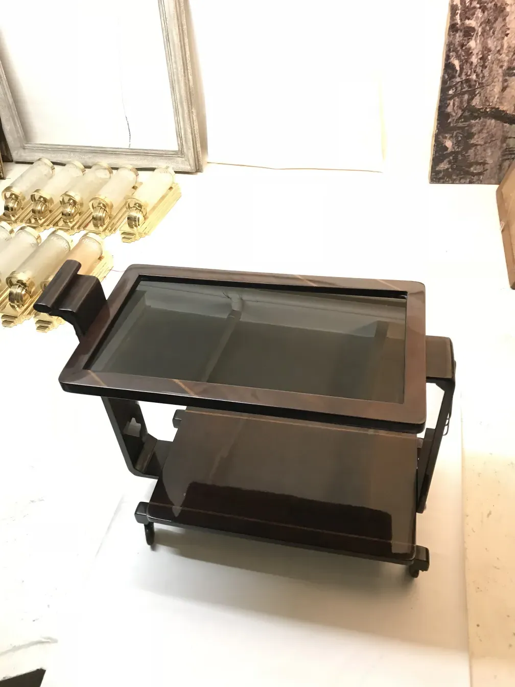 Antique cocktail trolley with elegant design, minimalistic background.