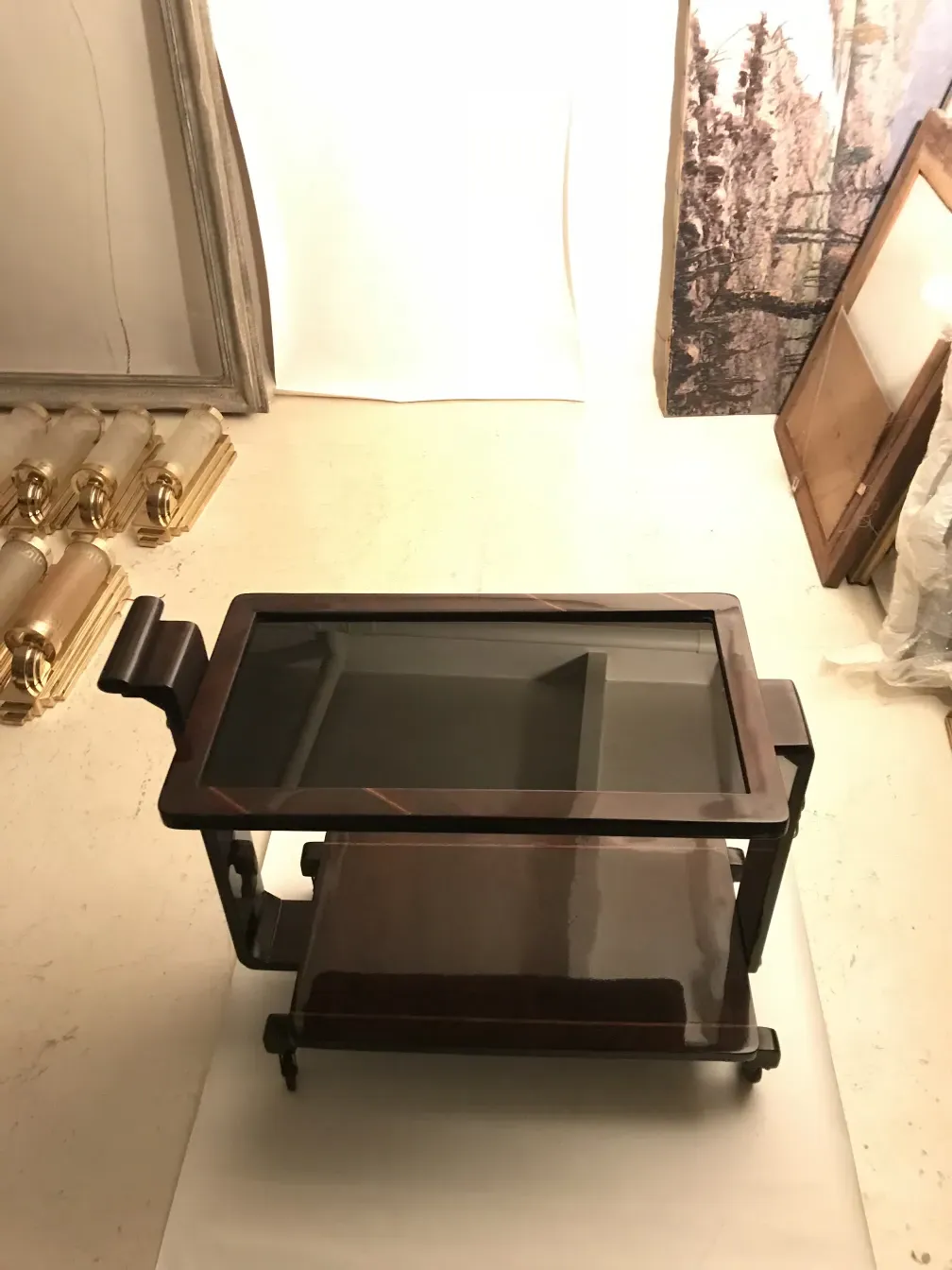 Antique cocktail trolley featuring elegant design and unique details in a cozy setting.