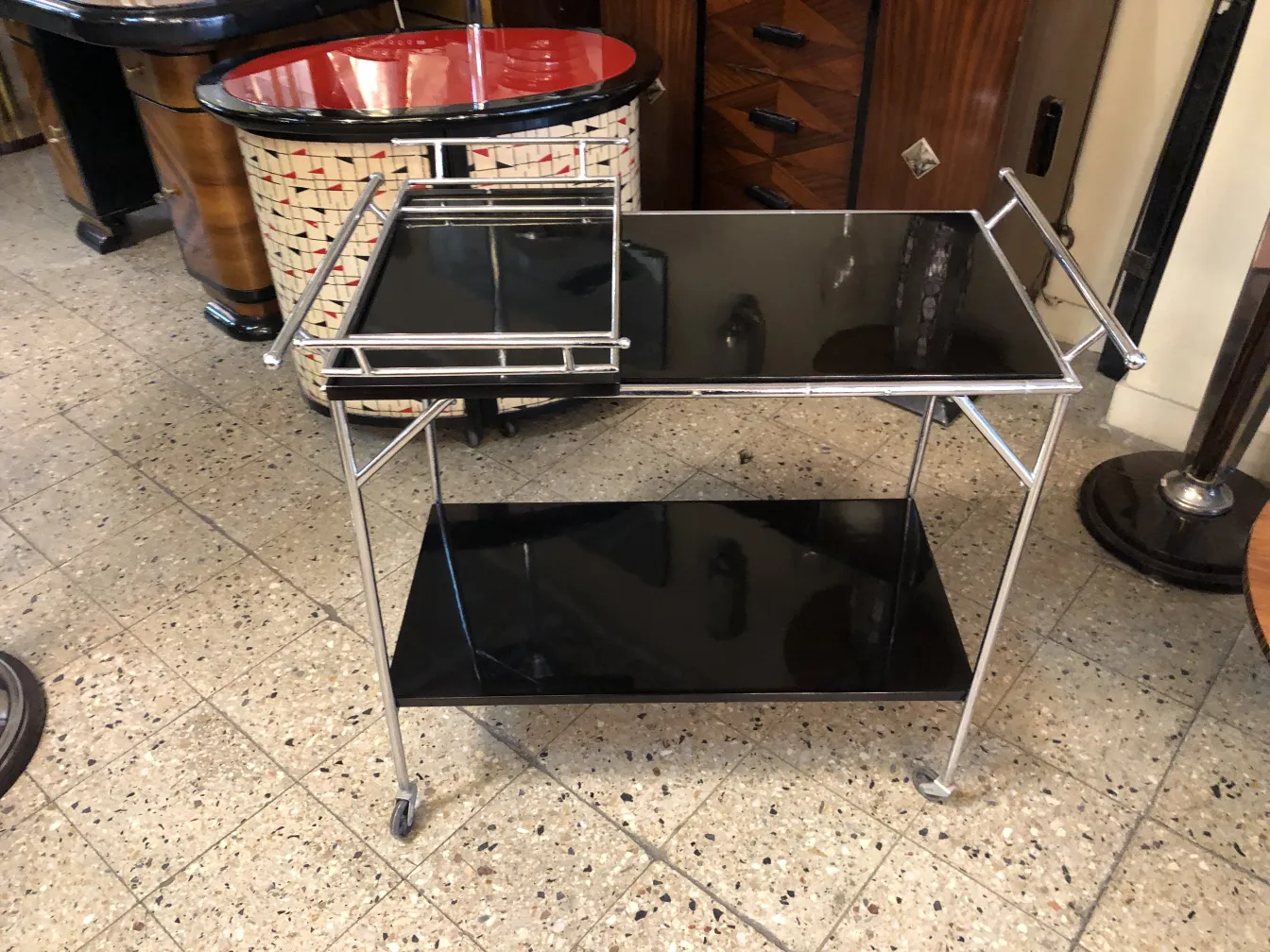 Antique cocktail trolley with black surface and wheels