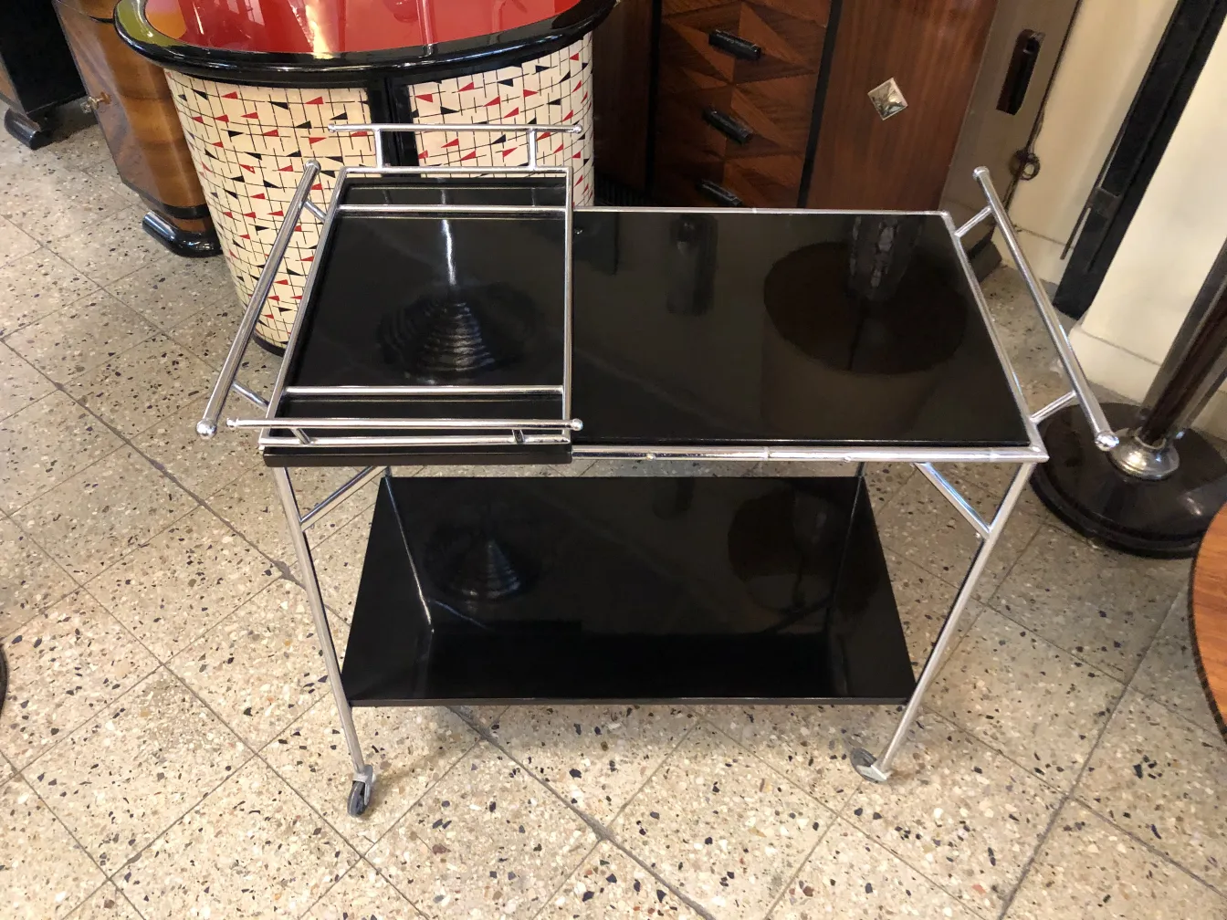 Antique cocktail trolley with elegant black metal design