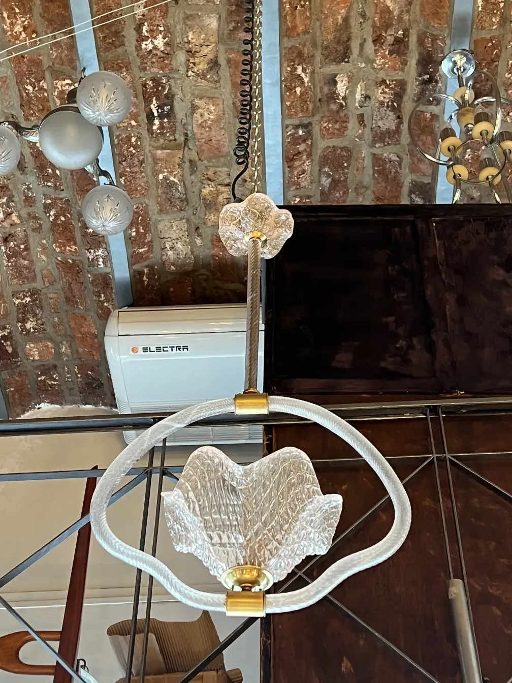 Elegant antique glass hanging lamp in a cozy environment.