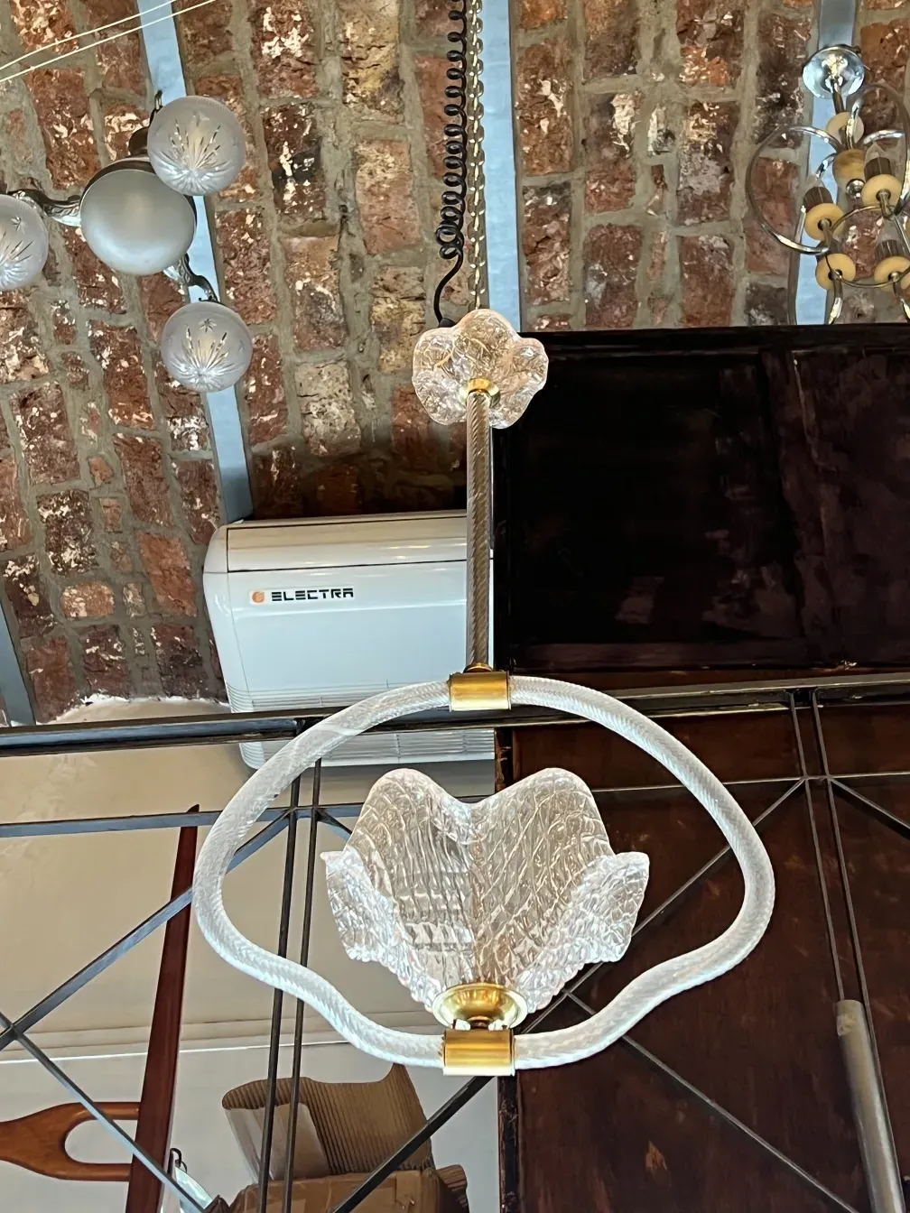 Antique hanging lamp with glass design and rustic setting