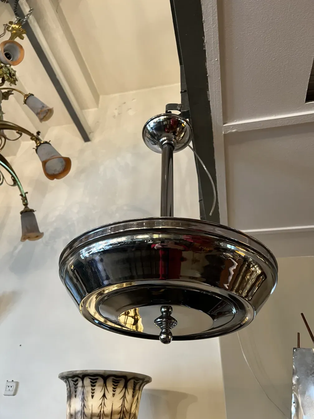 Antique hanging lamp with shiny finish and elegant details.