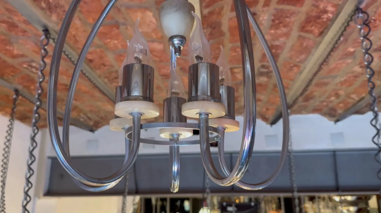 Antique hanging lamp with bright light, elegant design, cozy ambiance.