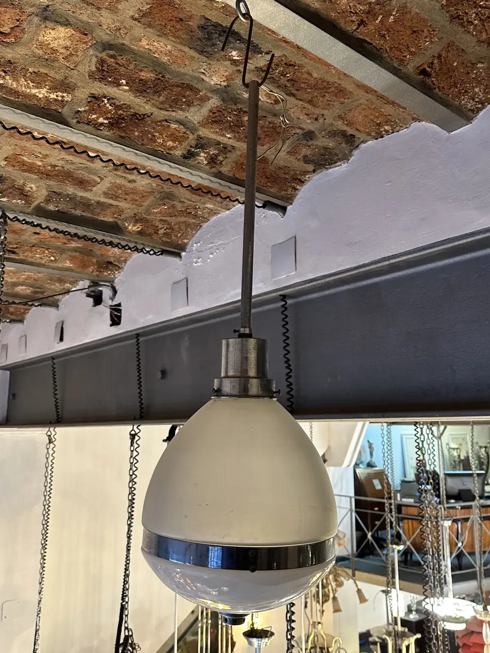 Antique white hanging lamp with a spherical design.