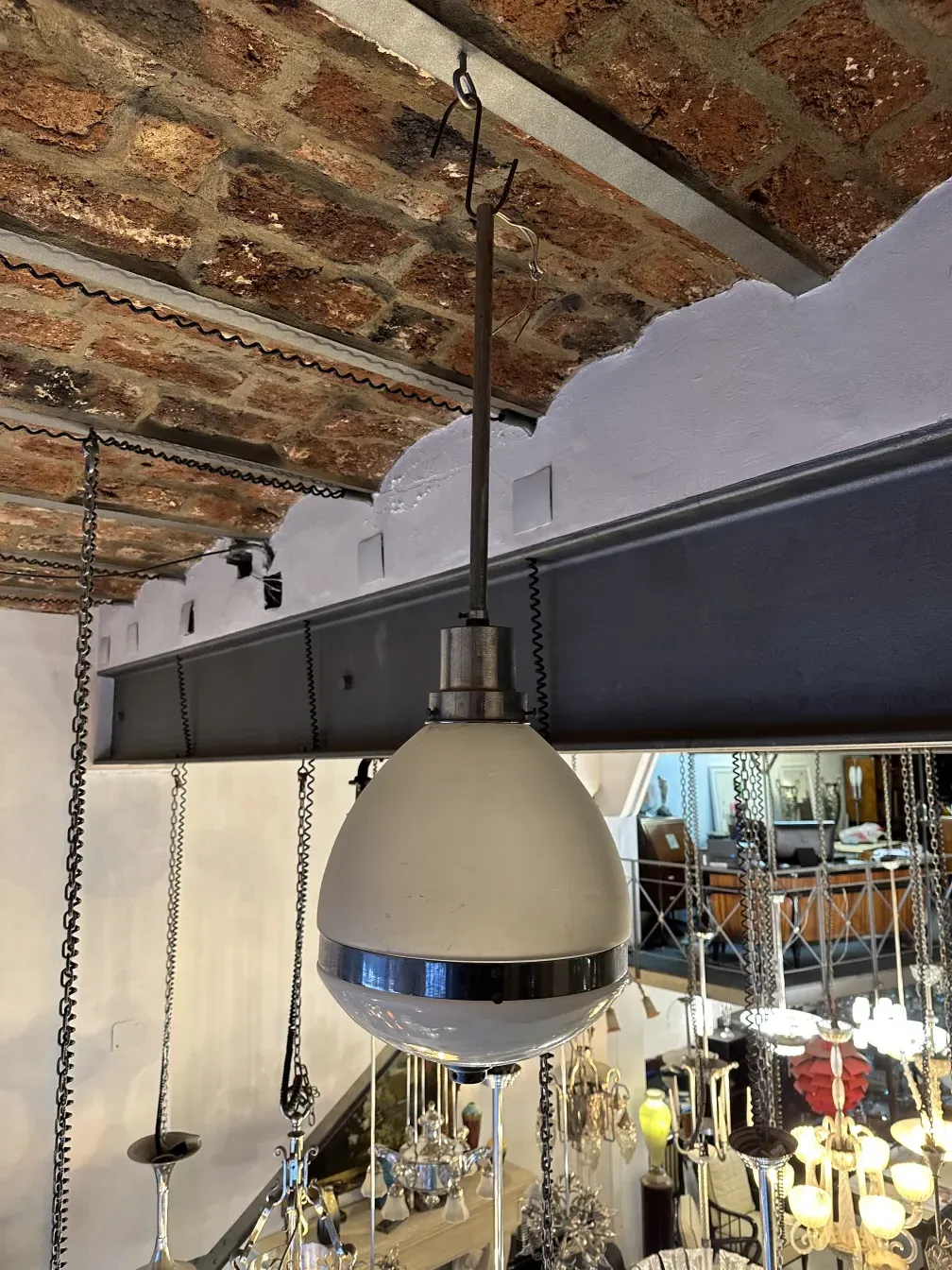 Antique hanging lamp, classic shape and elegant design, decorative details, in a cozy setting.