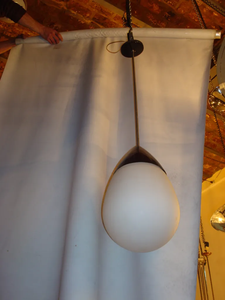 antique hanging lamp with simple and elegant design, suspended from the ceiling