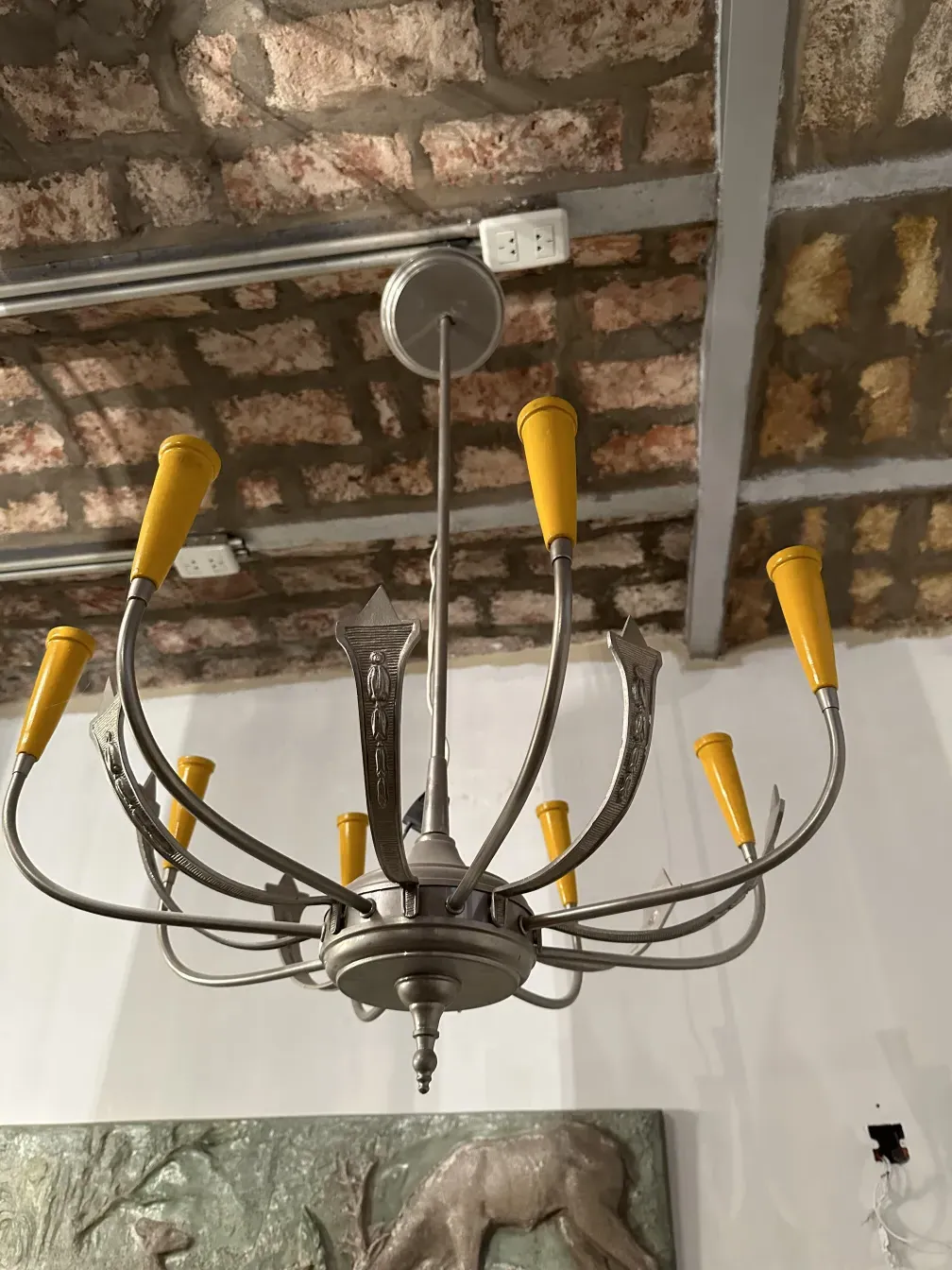 Antique hanging lamp with metal arms and yellow shades