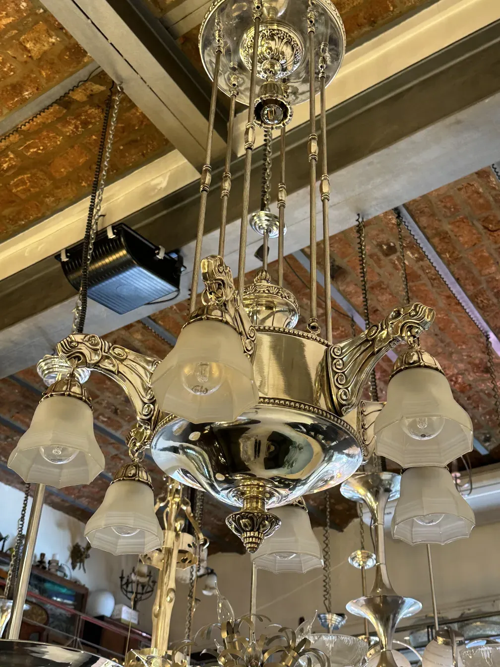 Antique hanging lamp with bright white lights, elegant style.