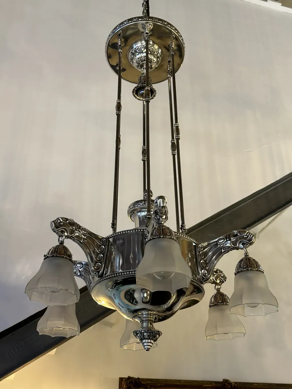 Antique hanging lamp with elegant glass lights, classic ambiance.