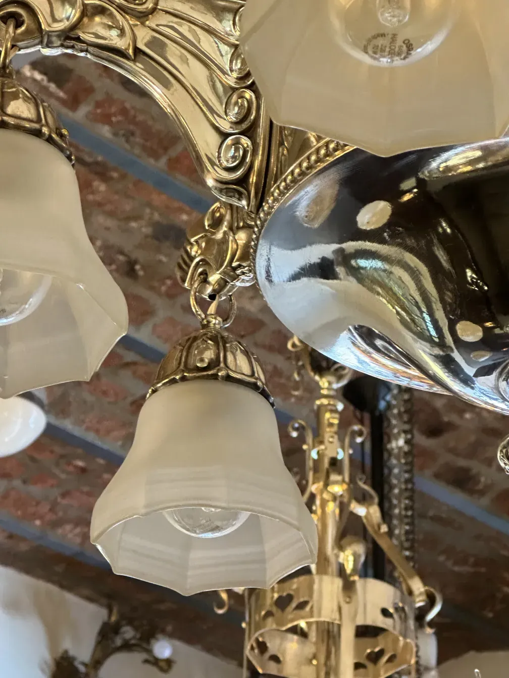 Antique hanging lamp with glass details and shine, elegant environment.