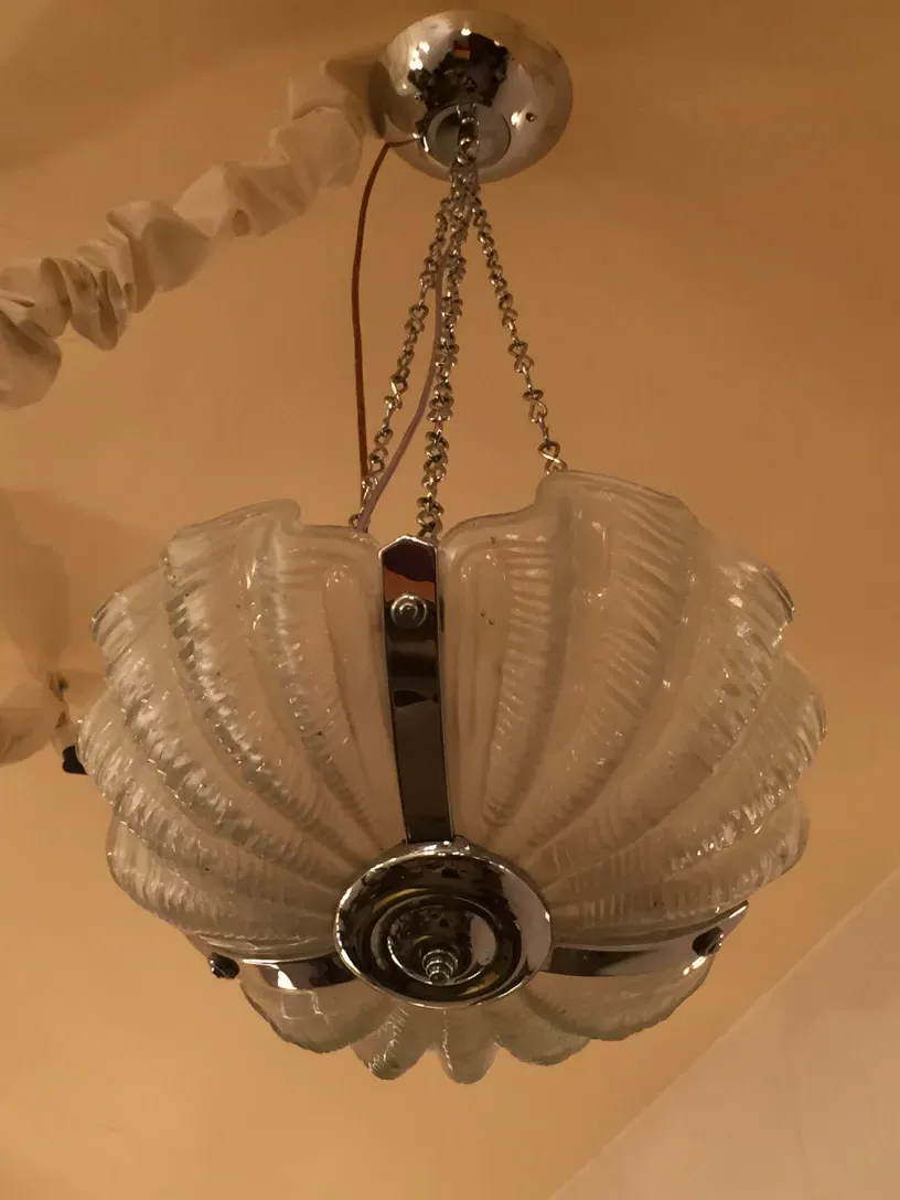 Antique hanging lamp made of glass with elegant details.