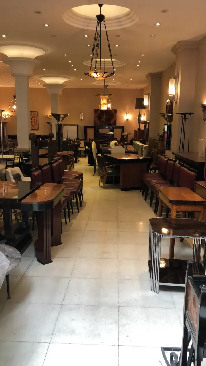 antique hanging lamp in an elegant dining room with various furniture