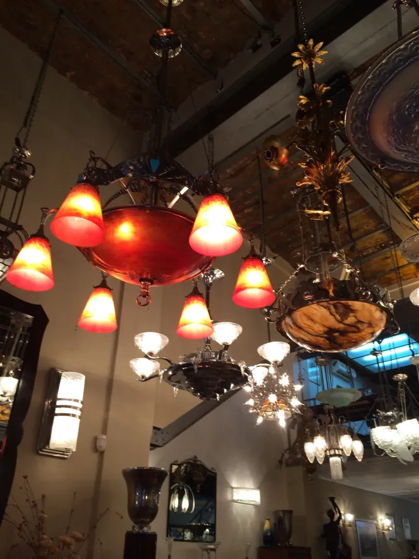 antique hanging lamp with red lights and elegant design, Charles Schneider, in a well-lit setting