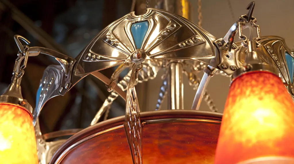 Antique hanging lamp by Charles Schneider featuring vibrant colors and decorative details.