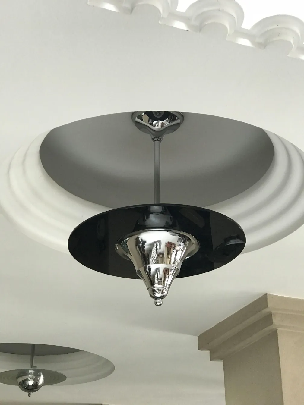 Antique hanging lamp featuring a sleek black design.