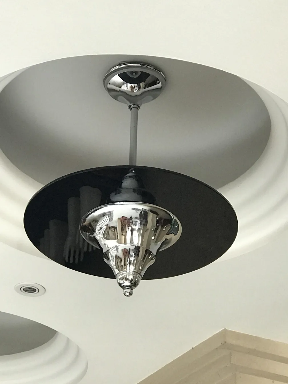 Antique ceiling lamp with a shiny and modern design, hanging from the ceiling