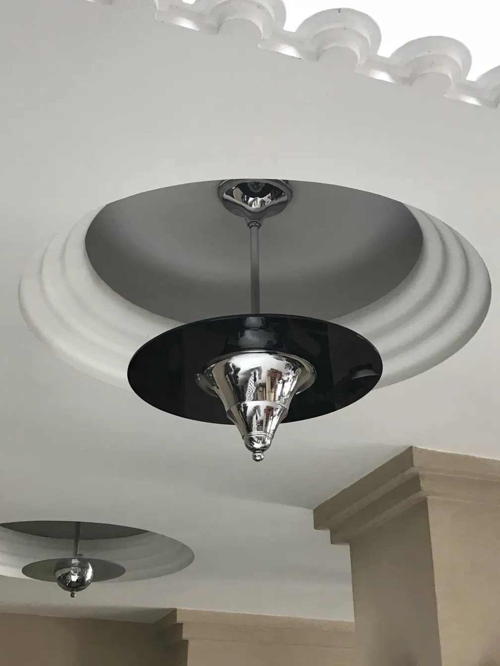 Antique hanging lamp featuring an elegant shiny design