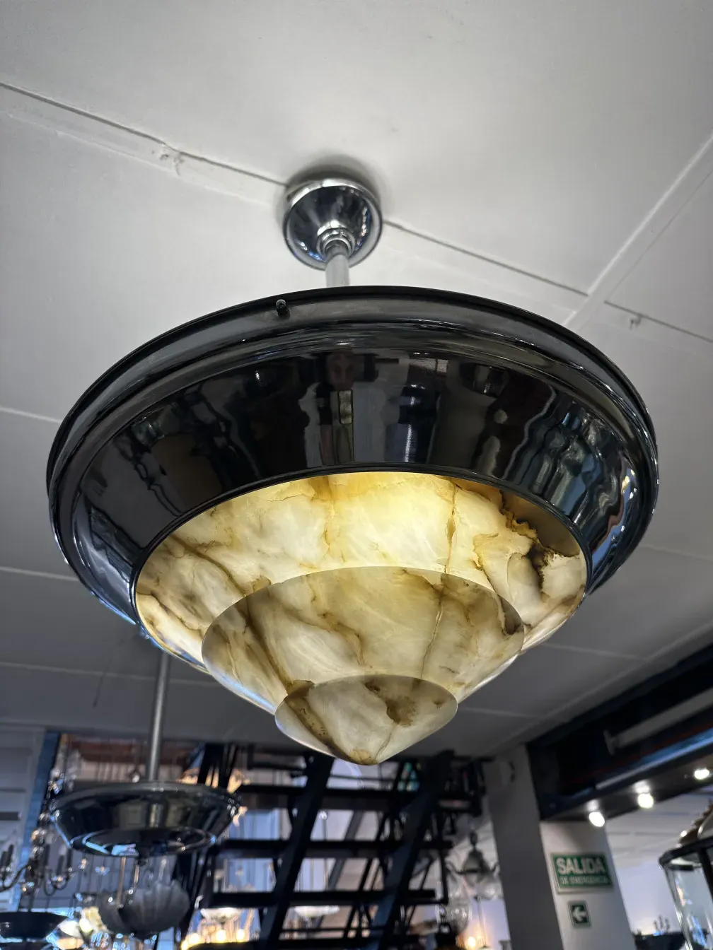 Antique hanging lamp with light tones, adds style to any space.