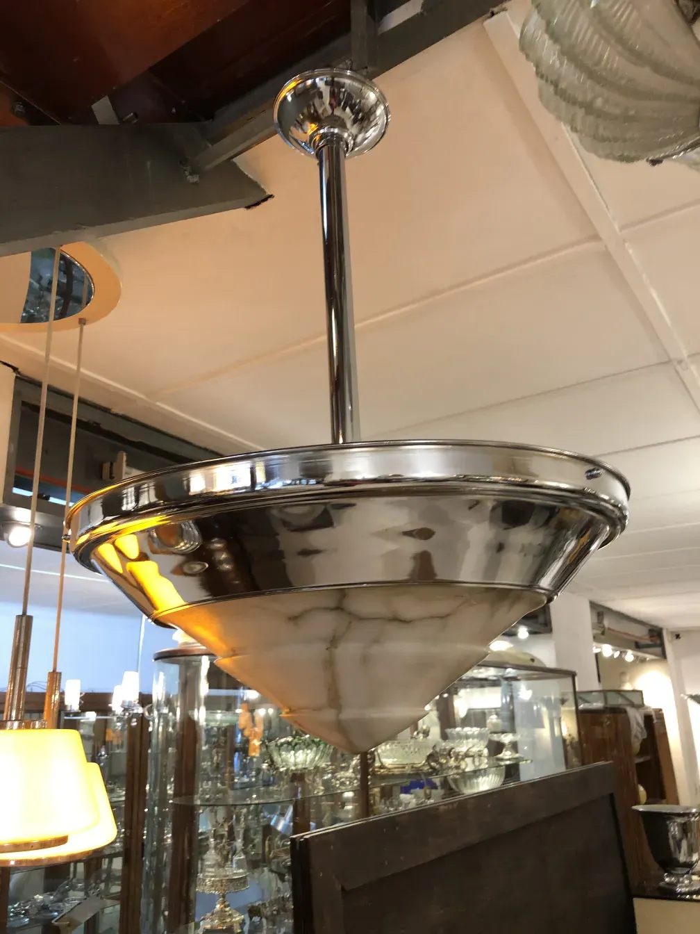 Antique hanging lamp in a cone shape with metallic shine