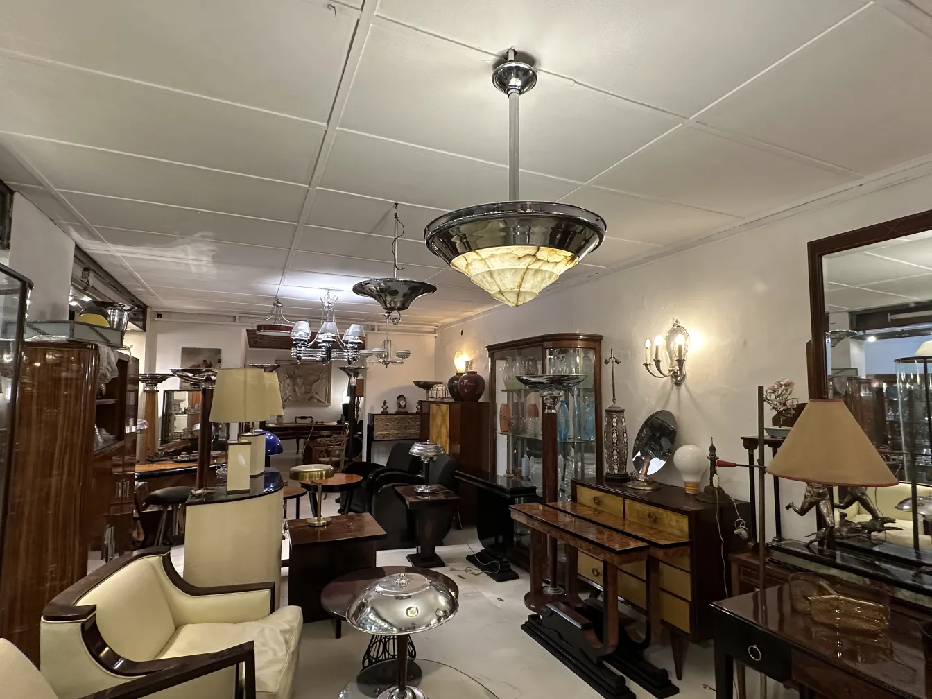 Antique hanging lamp with a distinctive design in a vintage setting.