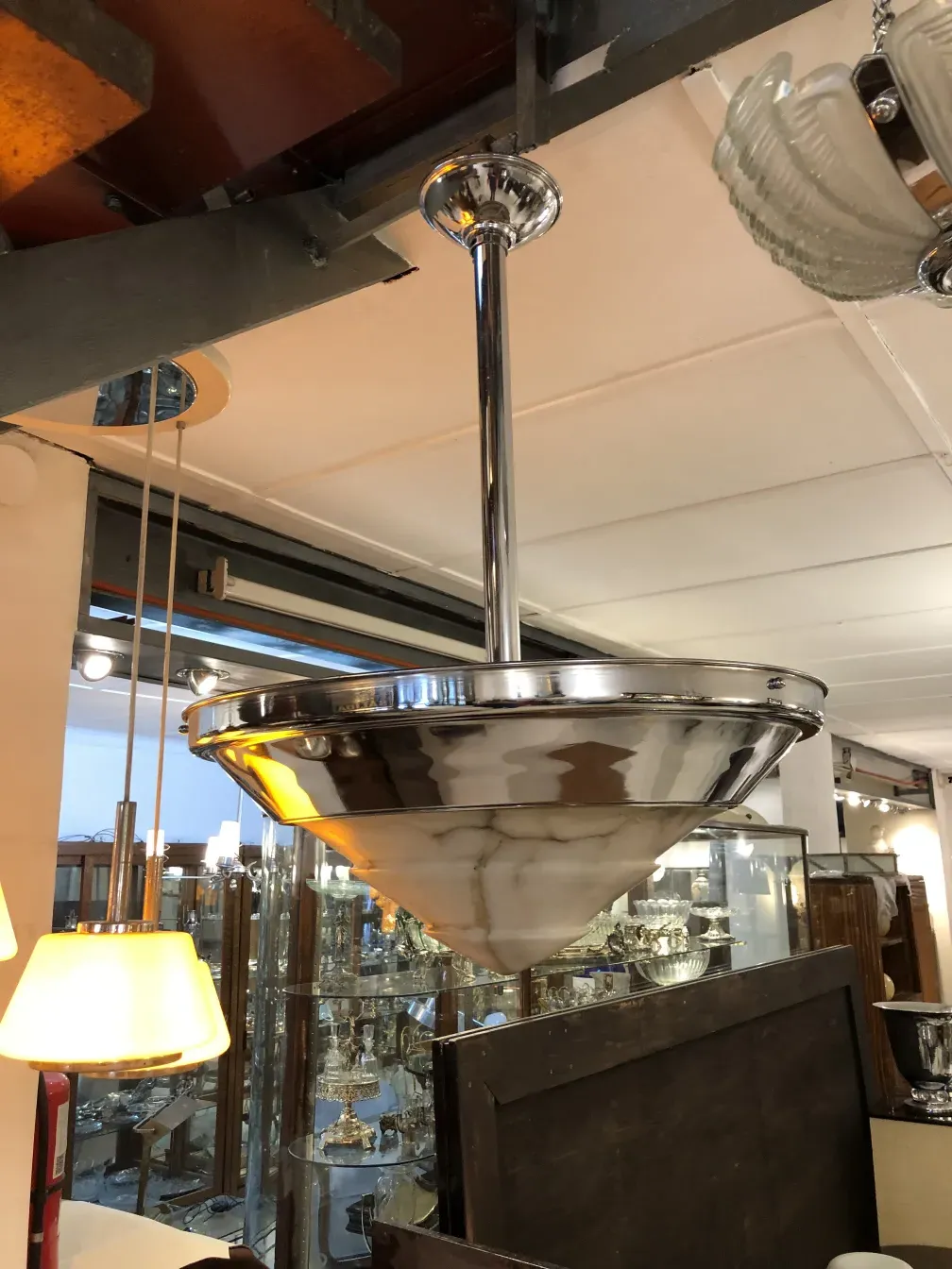 Antique hanging lamp with classic design and shiny finish, elegant ambiance