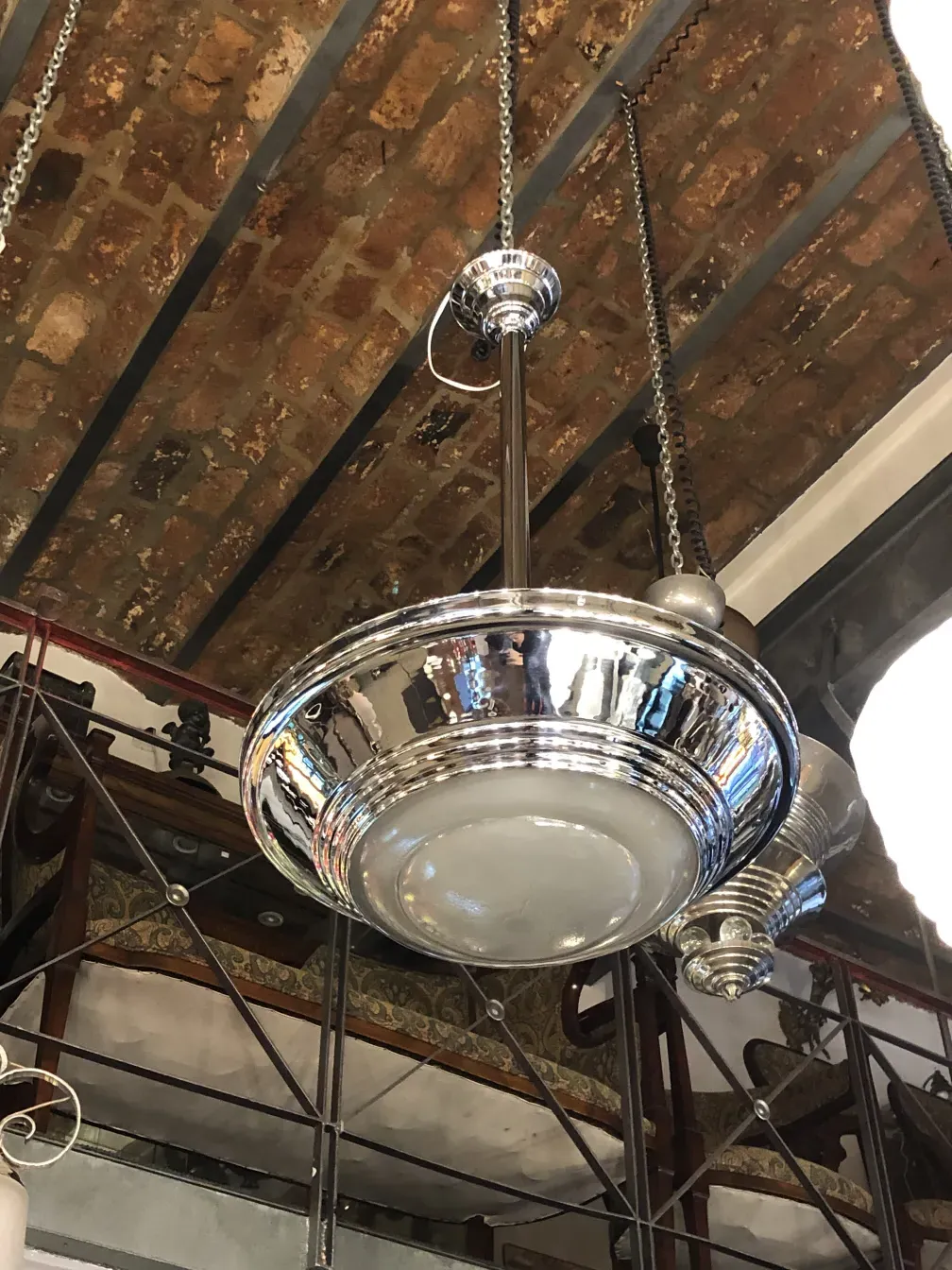 Antique hanging lamp with a shiny and elegant design.