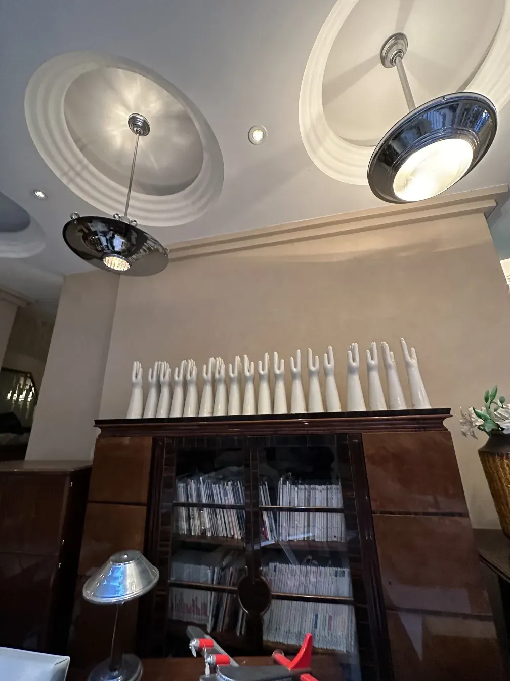 Antique hanging lamp in a modern setting with furniture