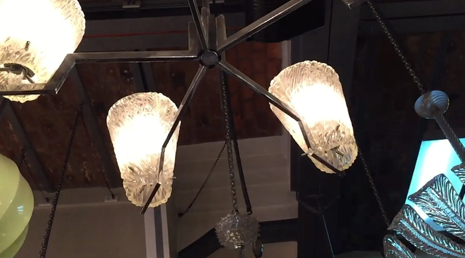 Antique hanging lamp with crystal lights in an elegant setting.