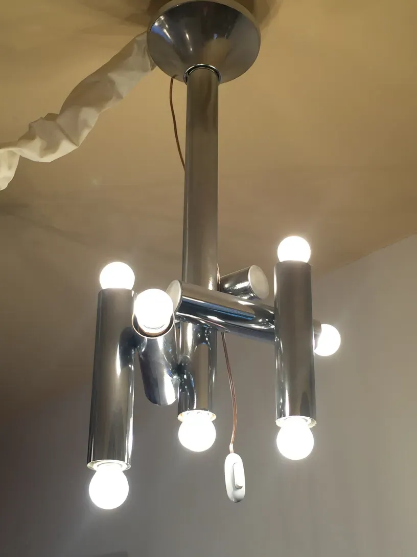 antique hanging lamp featuring multiple lit bulbs