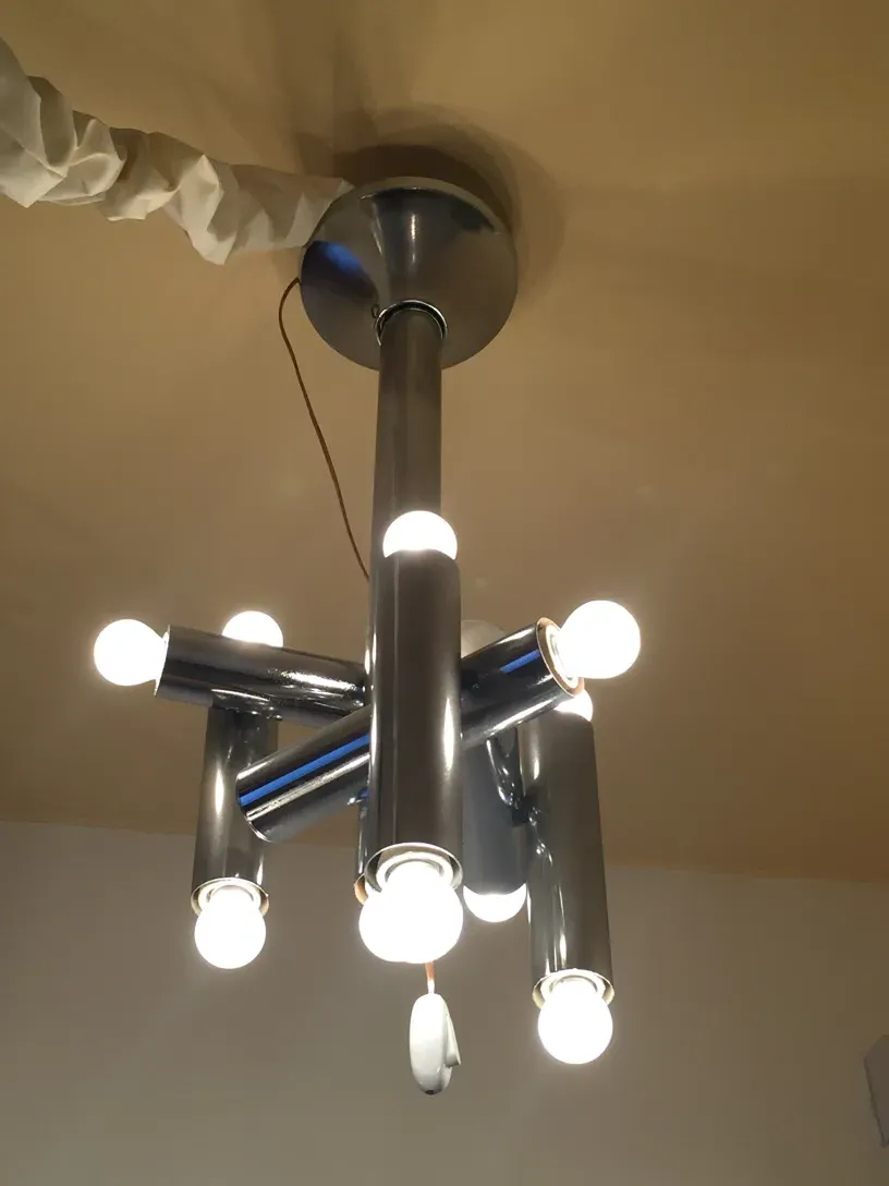 Antique hanging lamp with multiple bulbs brightening the space.