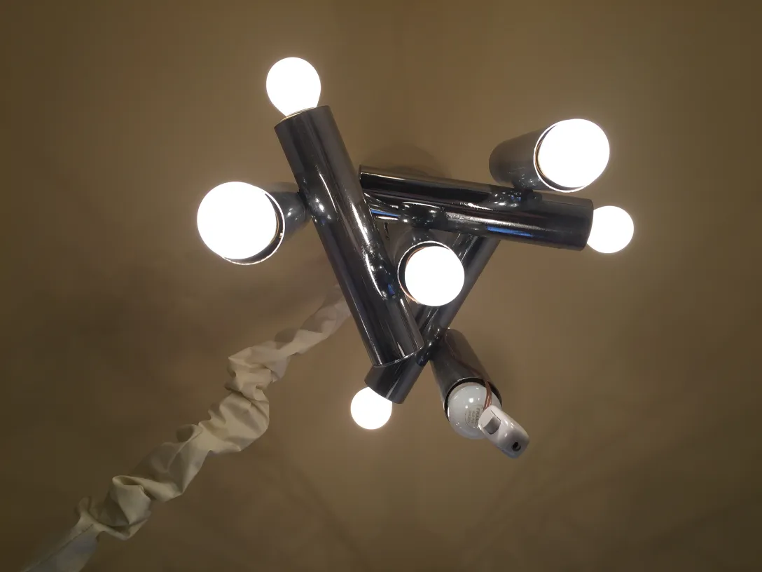 Antique hanging lamp with six bright bulbs, sleek modern design.