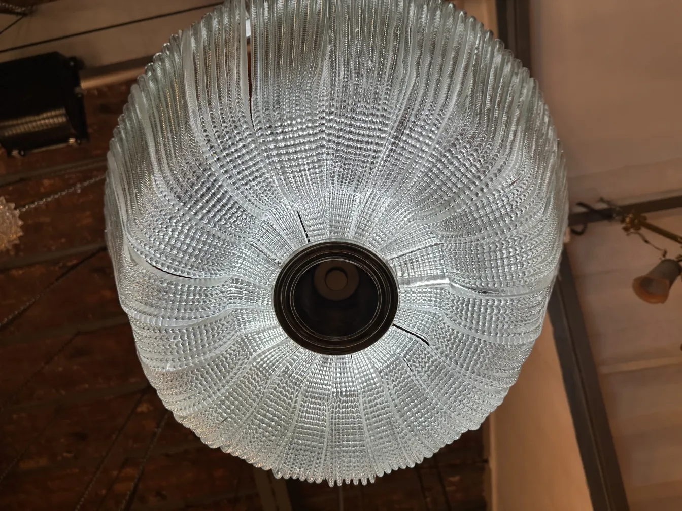 Antique hanging lamp with unique design, cozy ambiance.