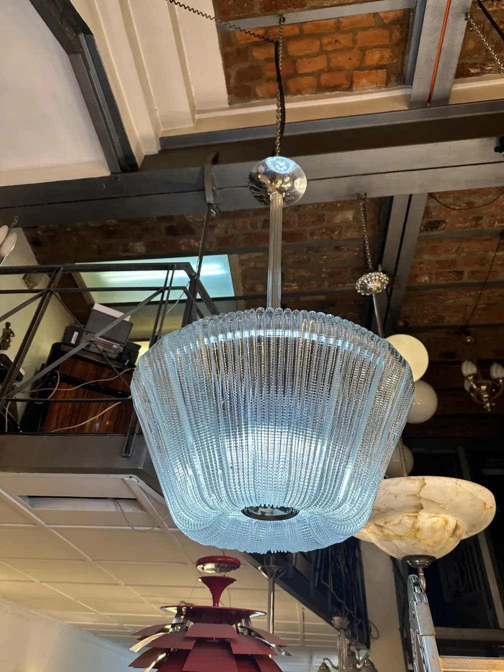 Antique hanging lamp with elegant design, warm ambiance with decorative items