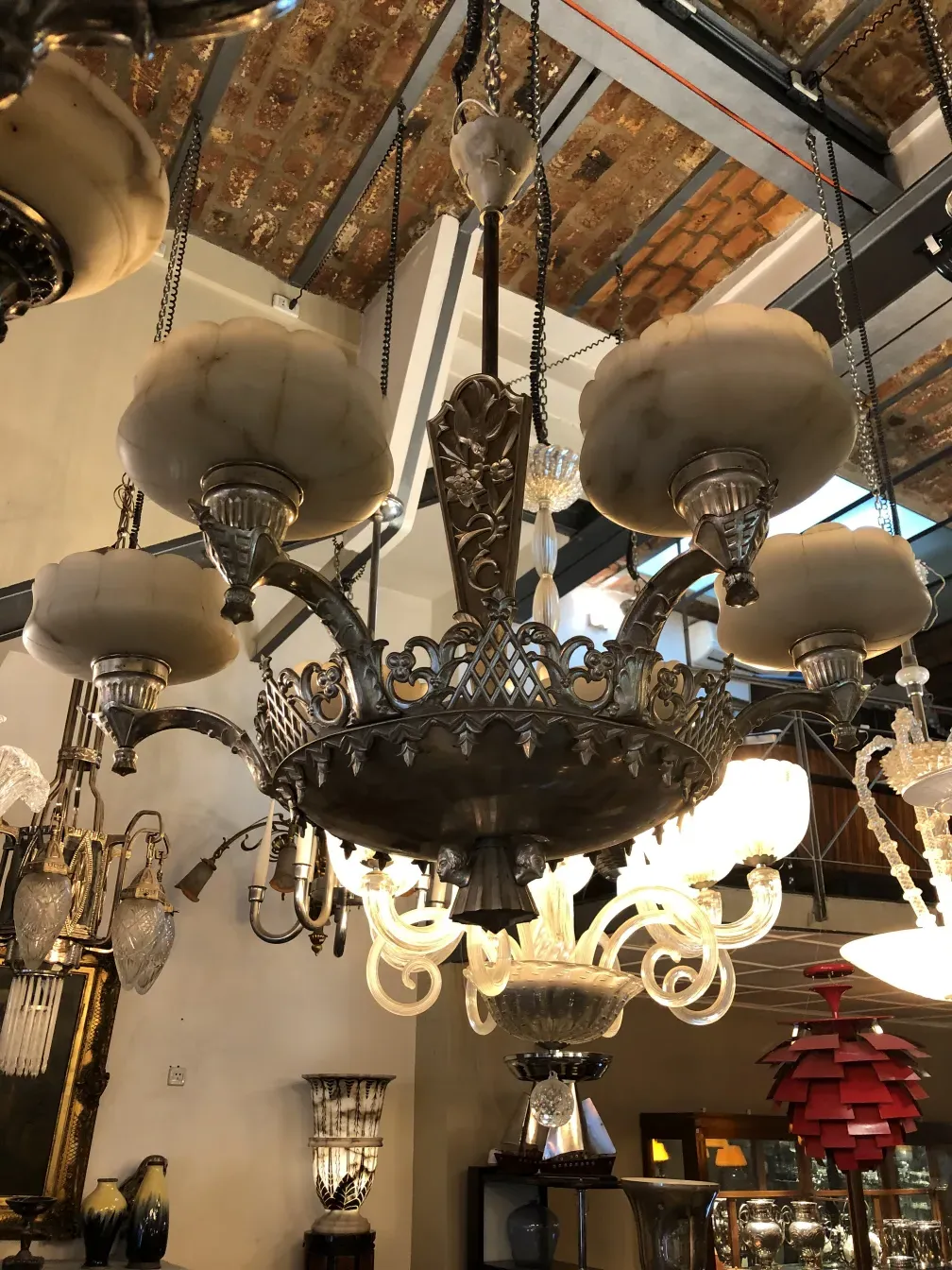 Antique hanging lamp featuring decorative details and crystals