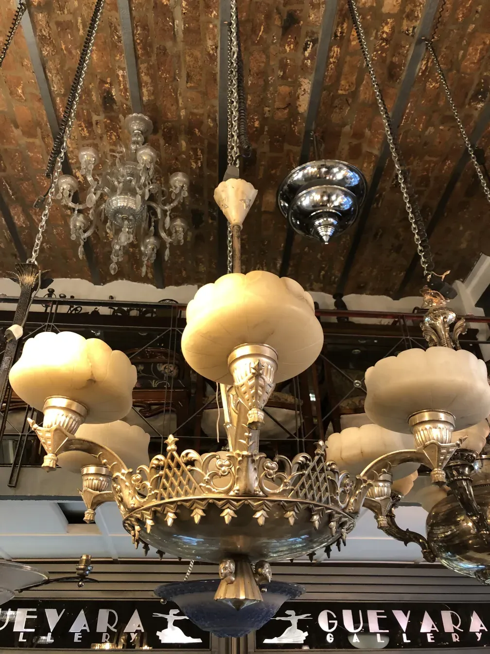 Antique hanging lamp with elegant details and chic style, illuminating a cozy environment.