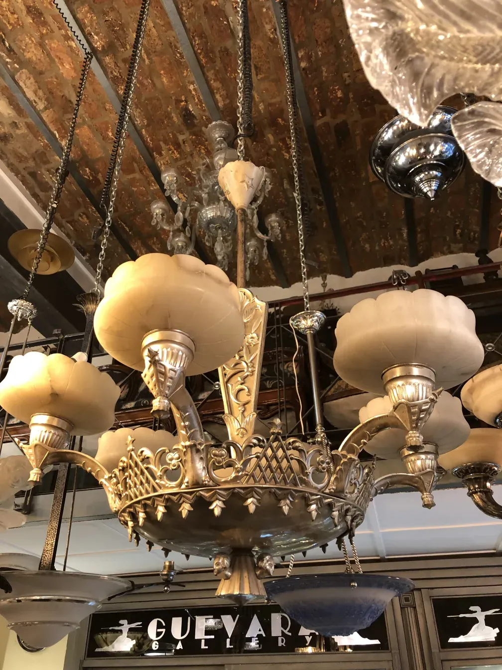 Antique hanging lamp with glass shades and ornate details