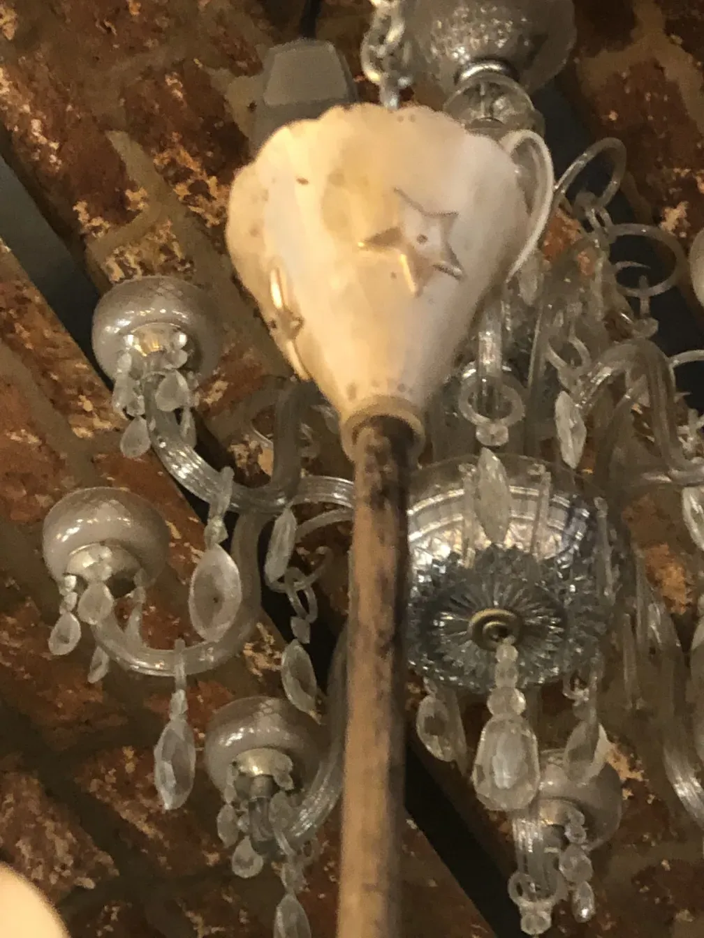 Antique hanging lamp featuring star designs, elegant style.