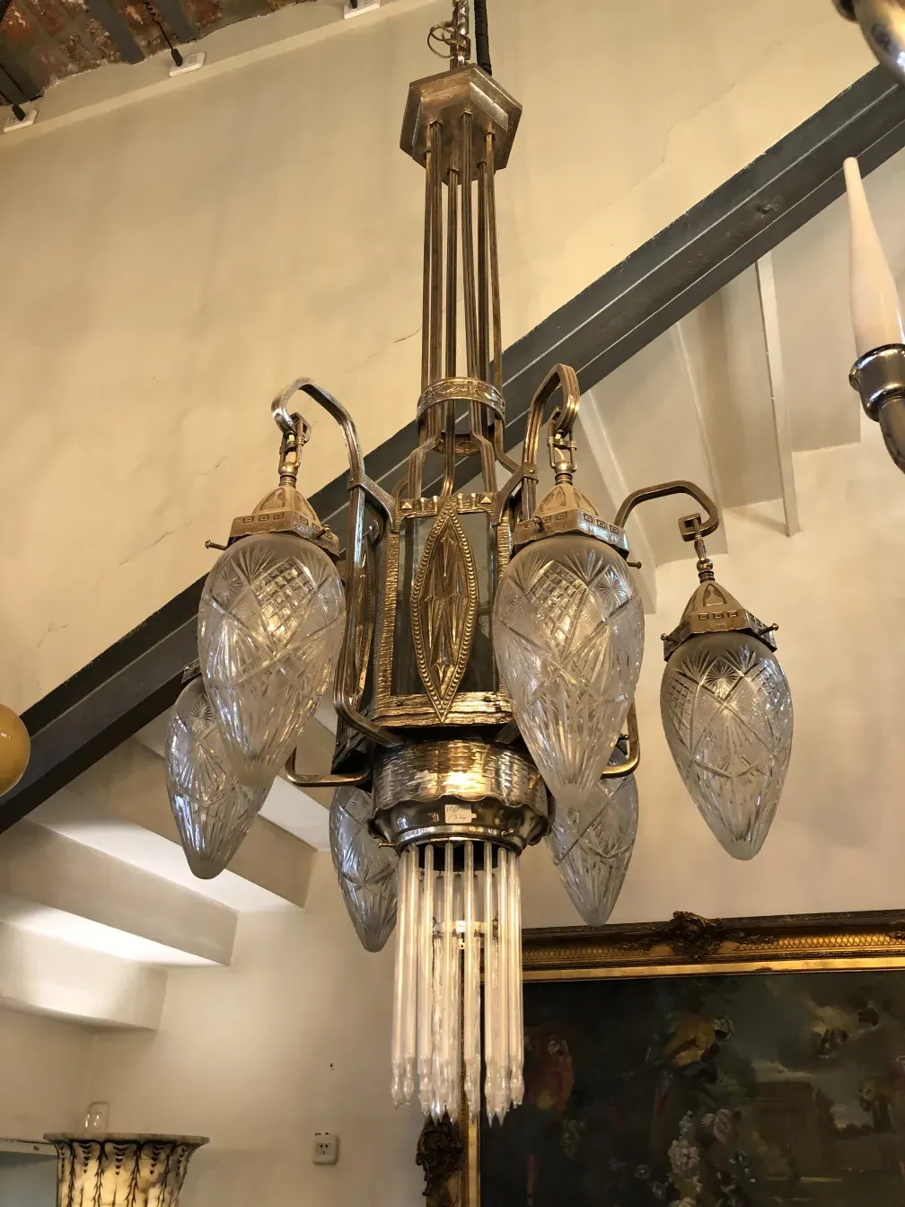 Antique hanging lamp showcasing intricate designs and hanging bulbs.